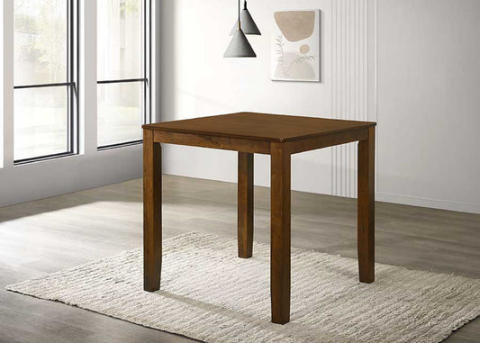 Warm walnut wood square dining table with tapered legs on textured rug