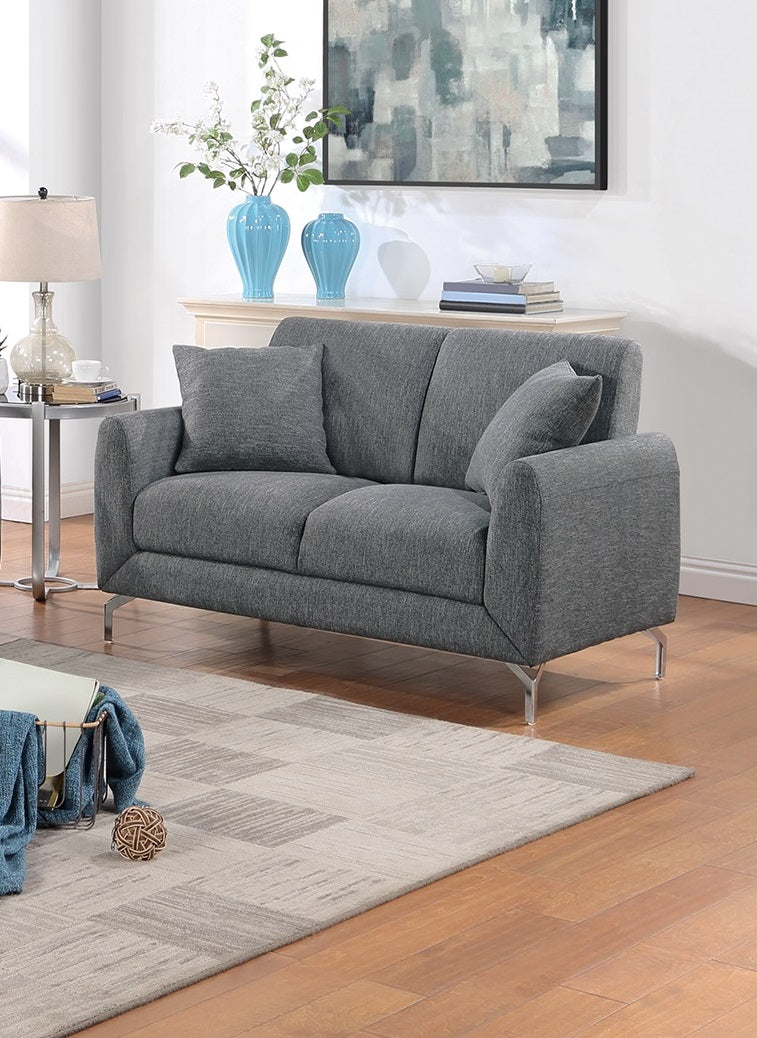 Dark gray fabric loveseat with chrome legs and two accent pillows