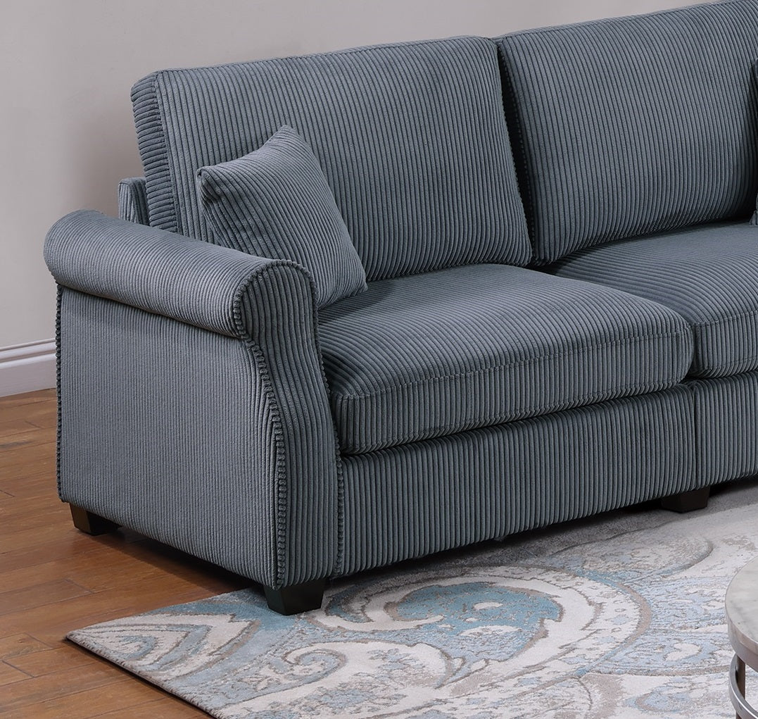 Comfortable grey corduroy sofa with rolled arms and decorative piping details