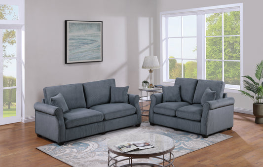 Two blue corduroy sofas with rolled arms and plush cushions perfect for a modern living room