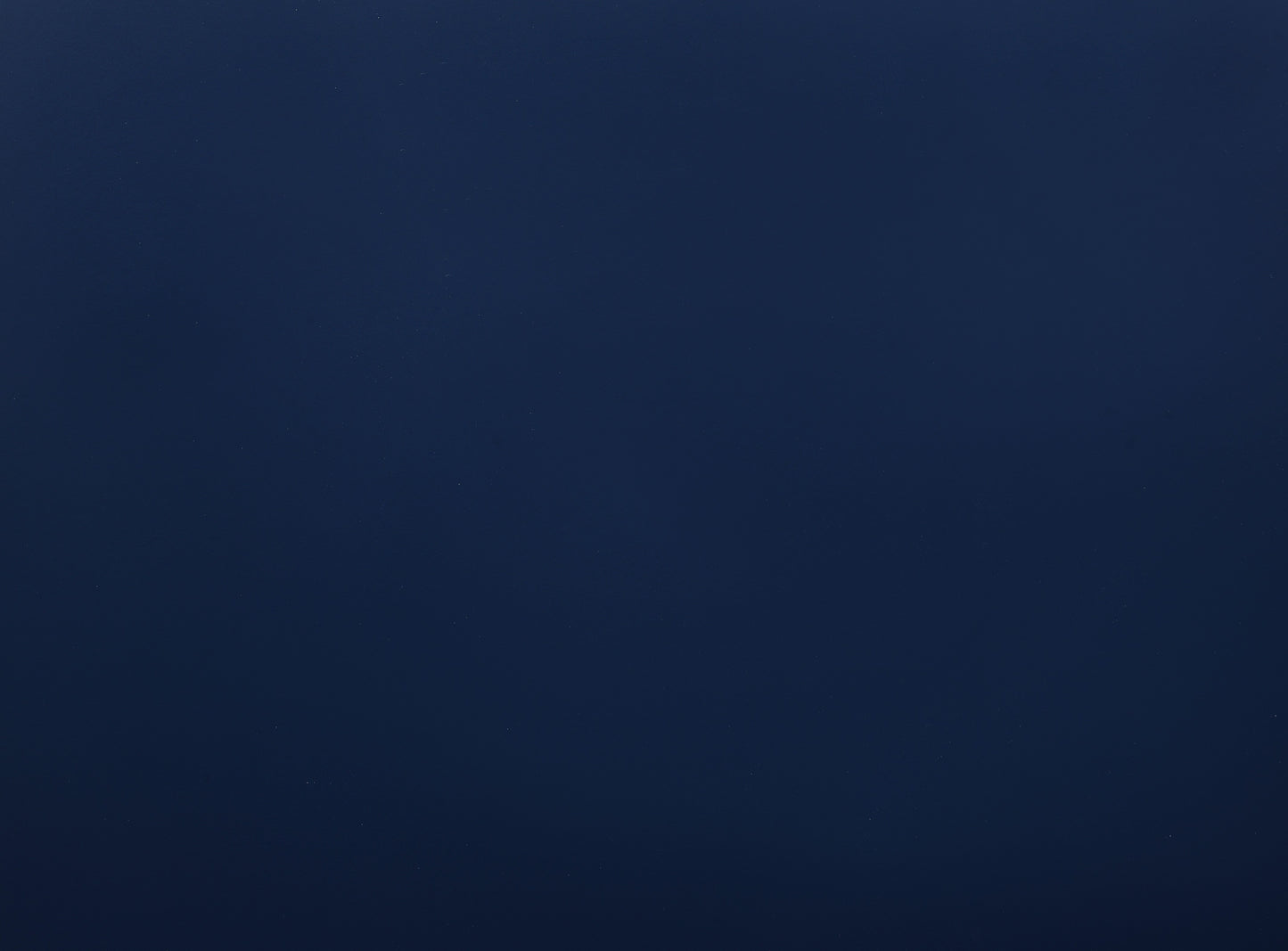 Dark navy blue textured background with subtle speckles ideal for formal apparel