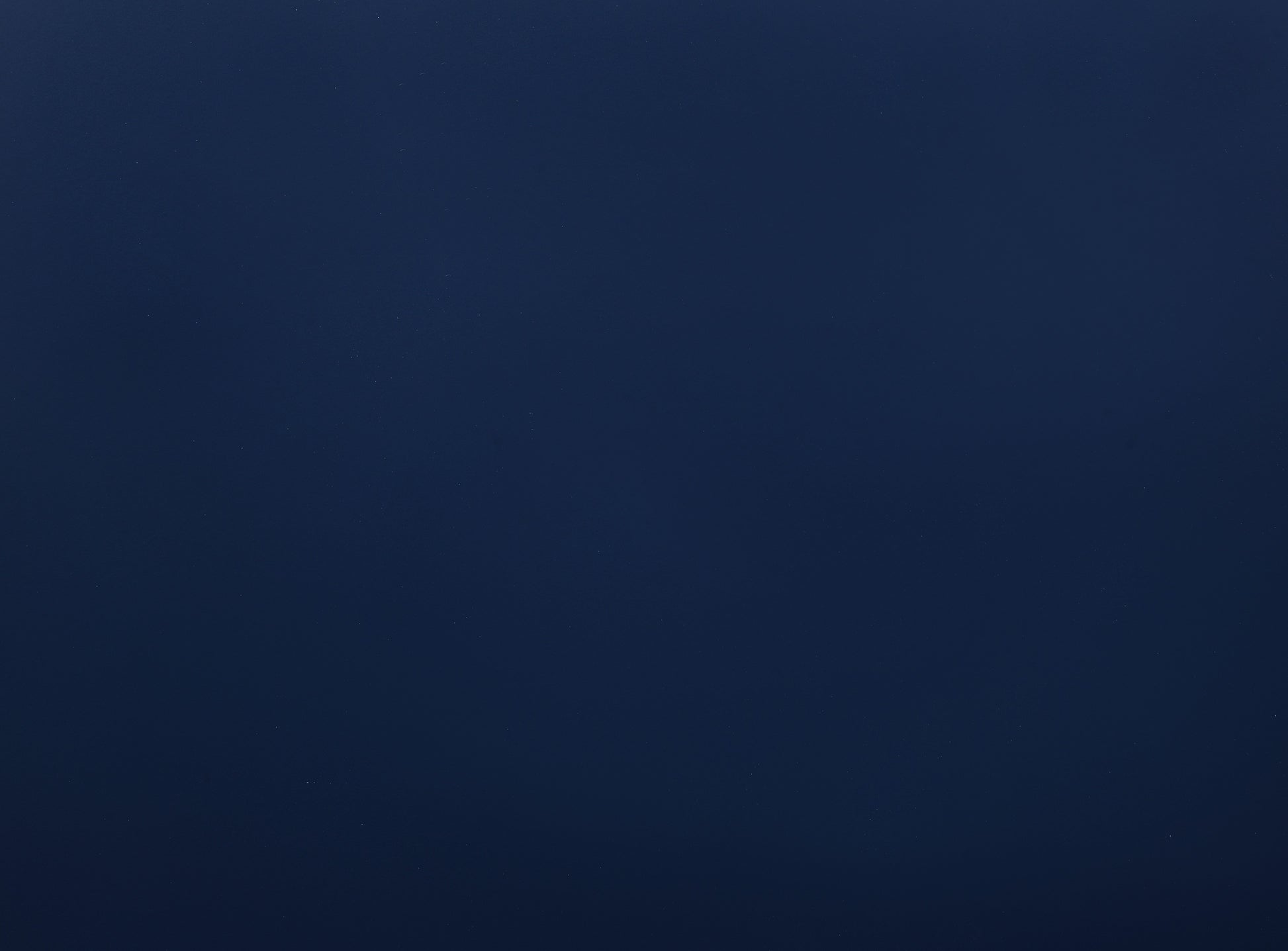 Dark navy blue textured background with subtle speckles ideal for formal apparel