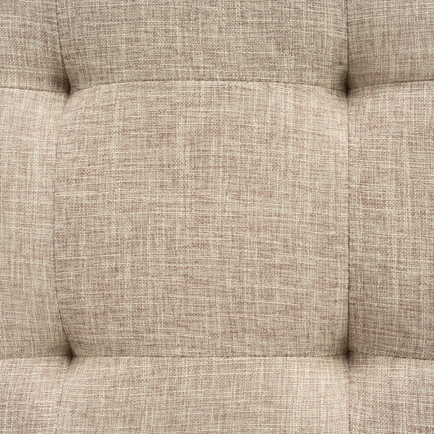 Closeup of textured neutral fabric upholstery with tufted detailing