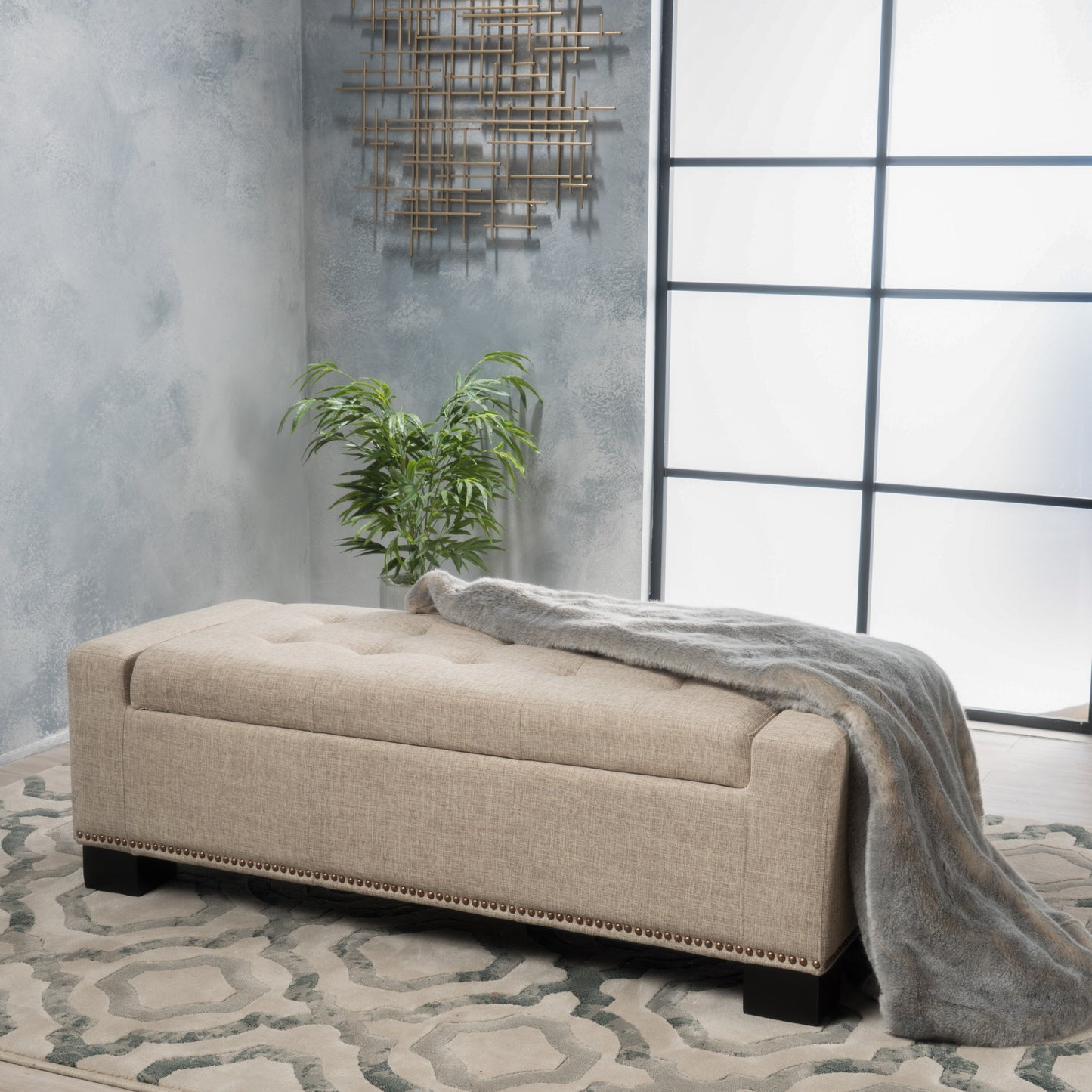 Beige tufted storage ottoman with nailhead trim