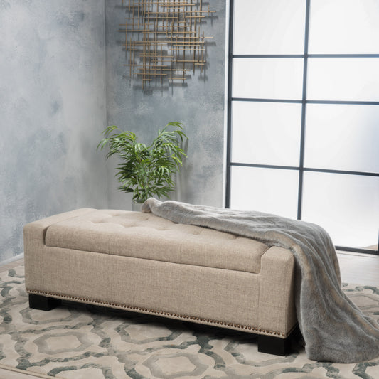 Beige tufted storage ottoman with nailhead trim