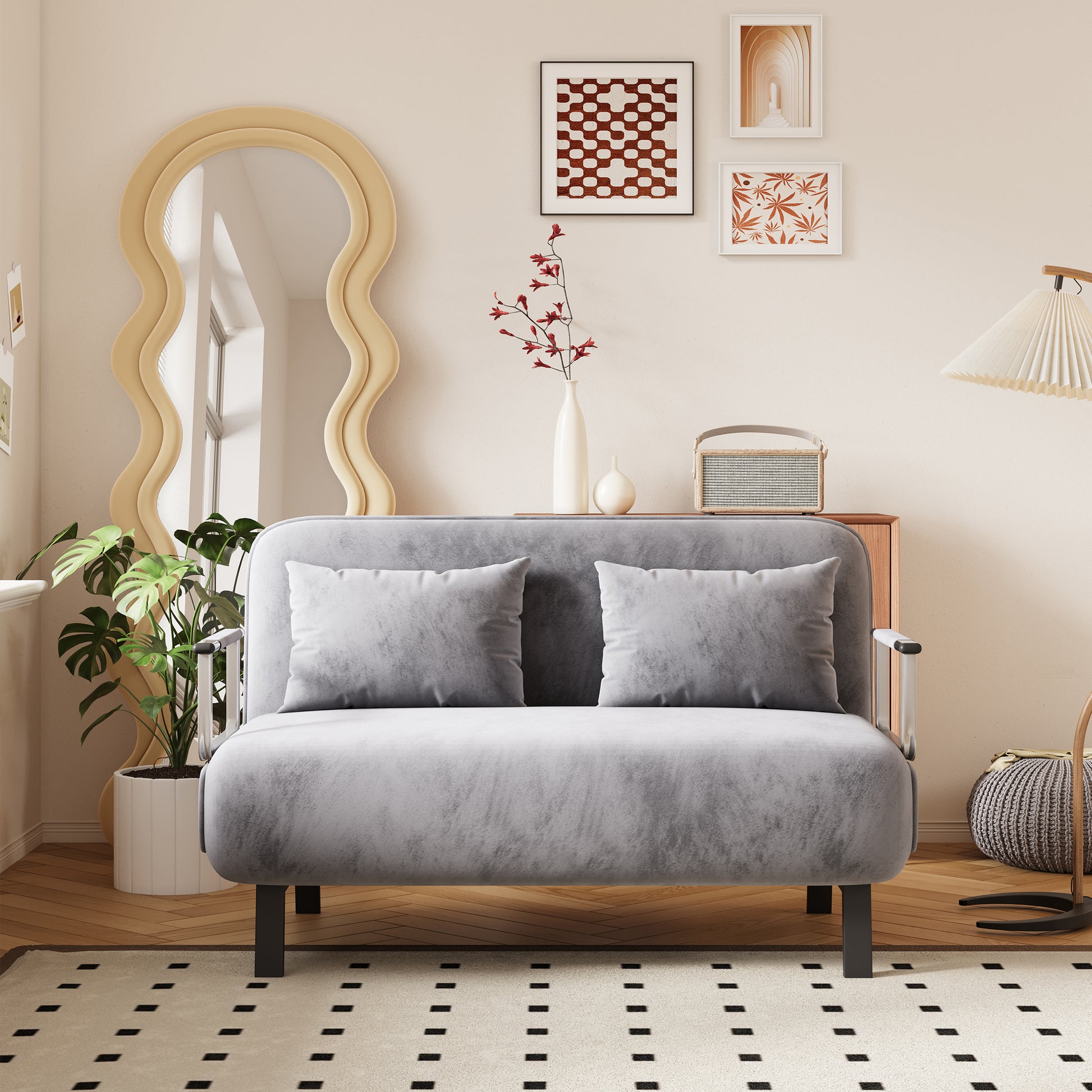 Soft grey velvet sofa with two plush cushions and sleek metal arms perfect for small spaces