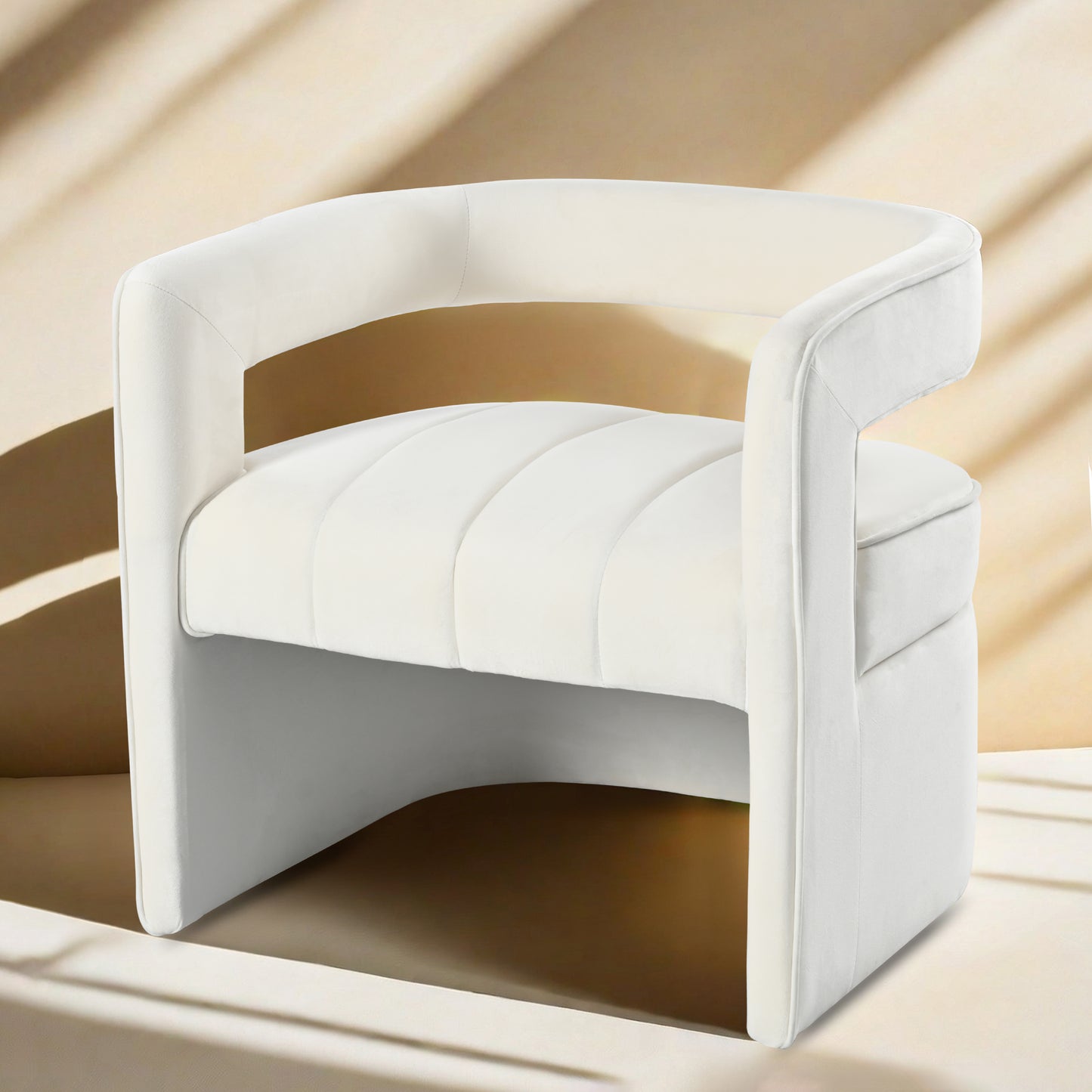 Luxurious cream velvet accent chair with channel tufted seat and curved arms