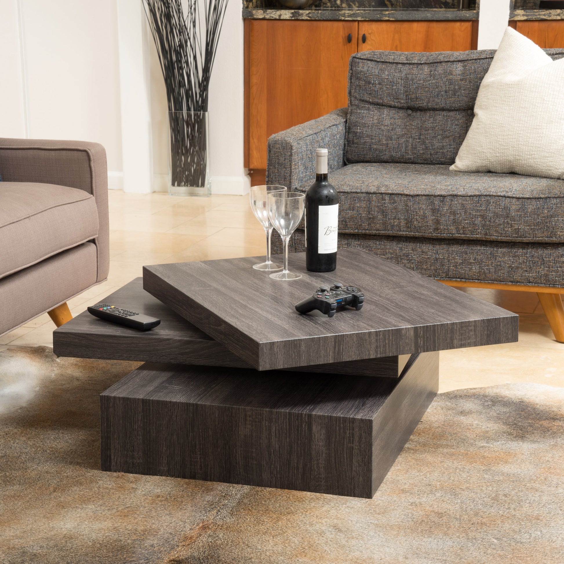 Rotating modern coffee table with dark wood finish featuring two levels
