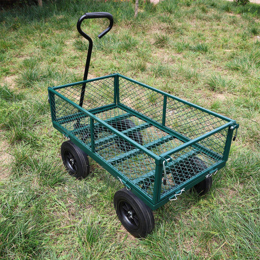 Green metal garden cart with mesh sides and black wheels on grass