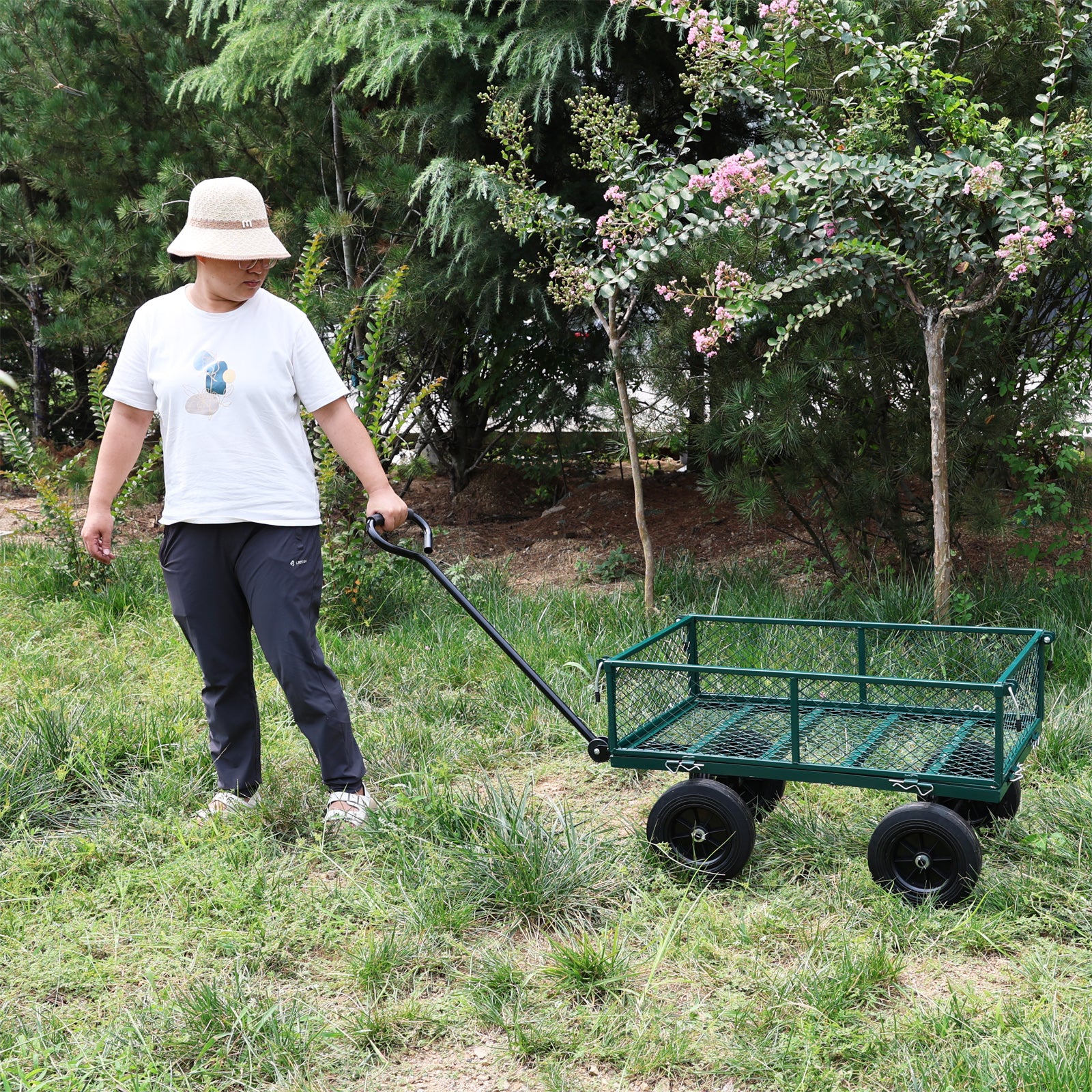 Green garden wagon with mesh bed and four black wheels perfect for hauling supplies