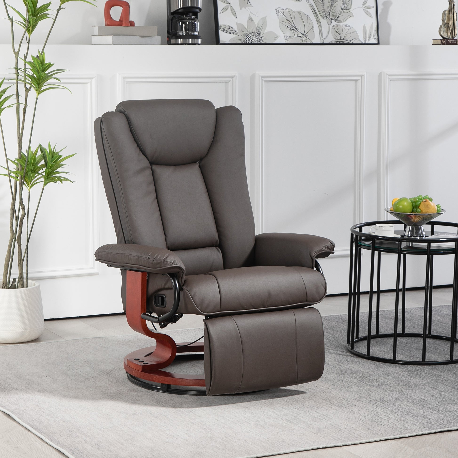 Brown leather recliner chair with wooden swivel base and footrest