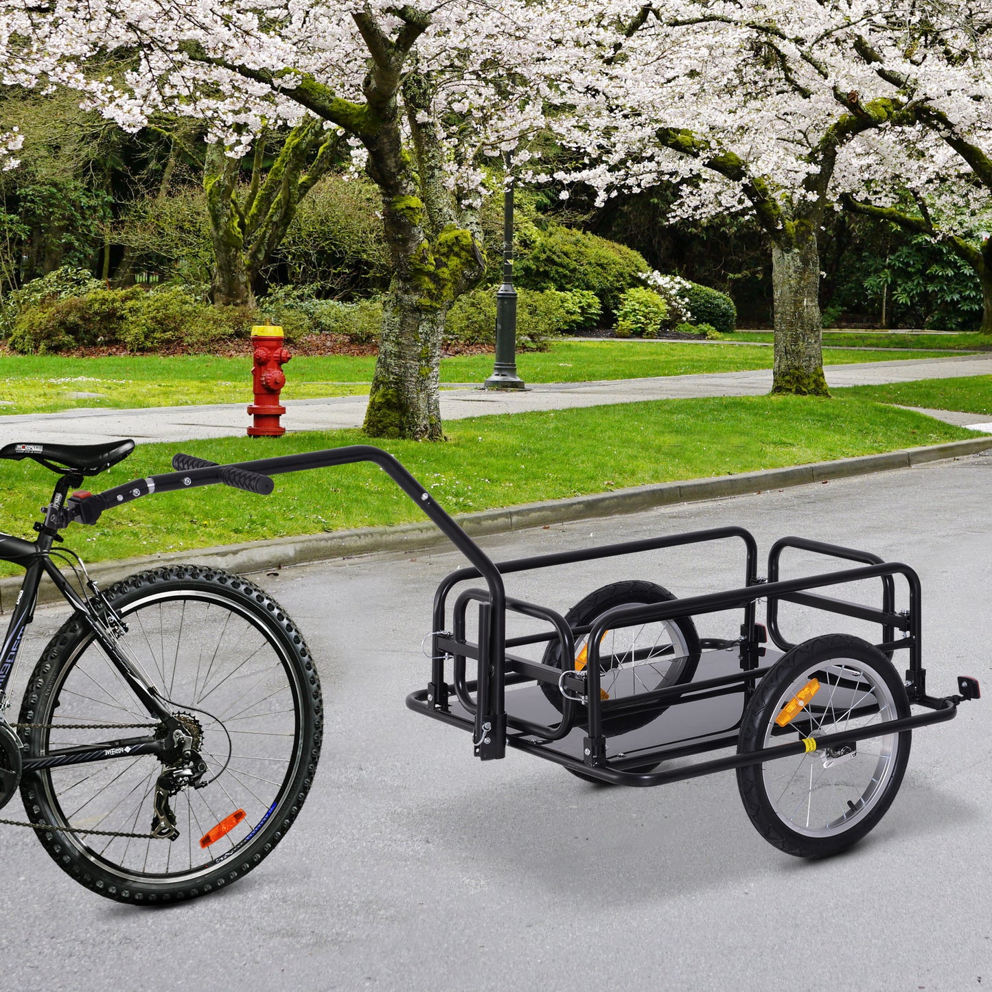 Black metal bicycle cargo trailer with two wheels and hitch mechanism