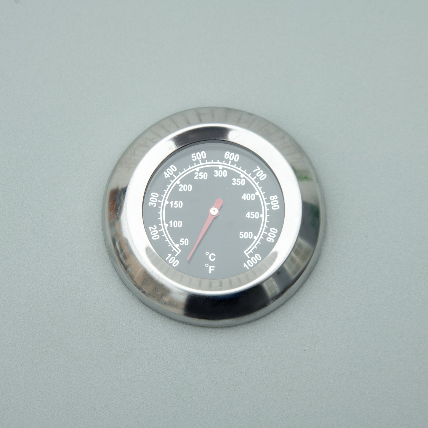 Stainless steel BBQ thermometer with dual Celsius and Fahrenheit display reading F