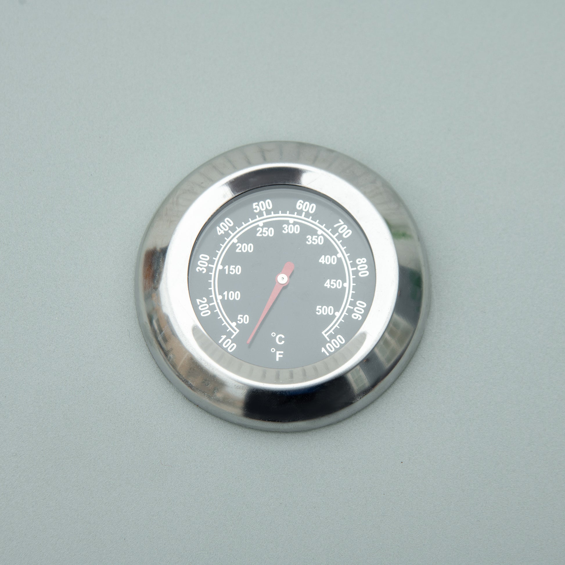 Stainless steel BBQ thermometer with dual Celsius and Fahrenheit display reading F