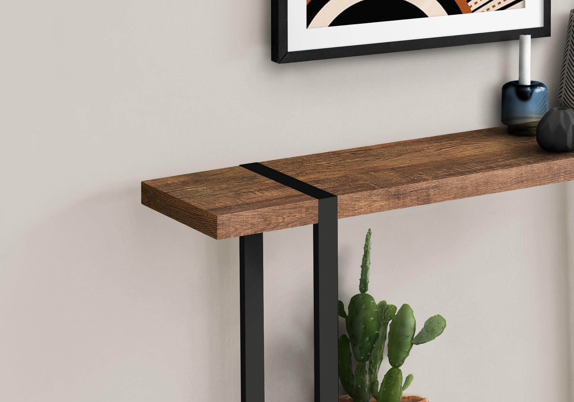 Rustic wood console table with black metal legs and decorative black band detail