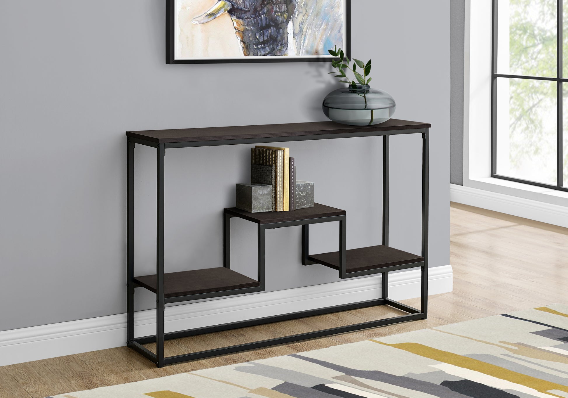 Dark espresso console table with black metal frame featuring staggered shelves