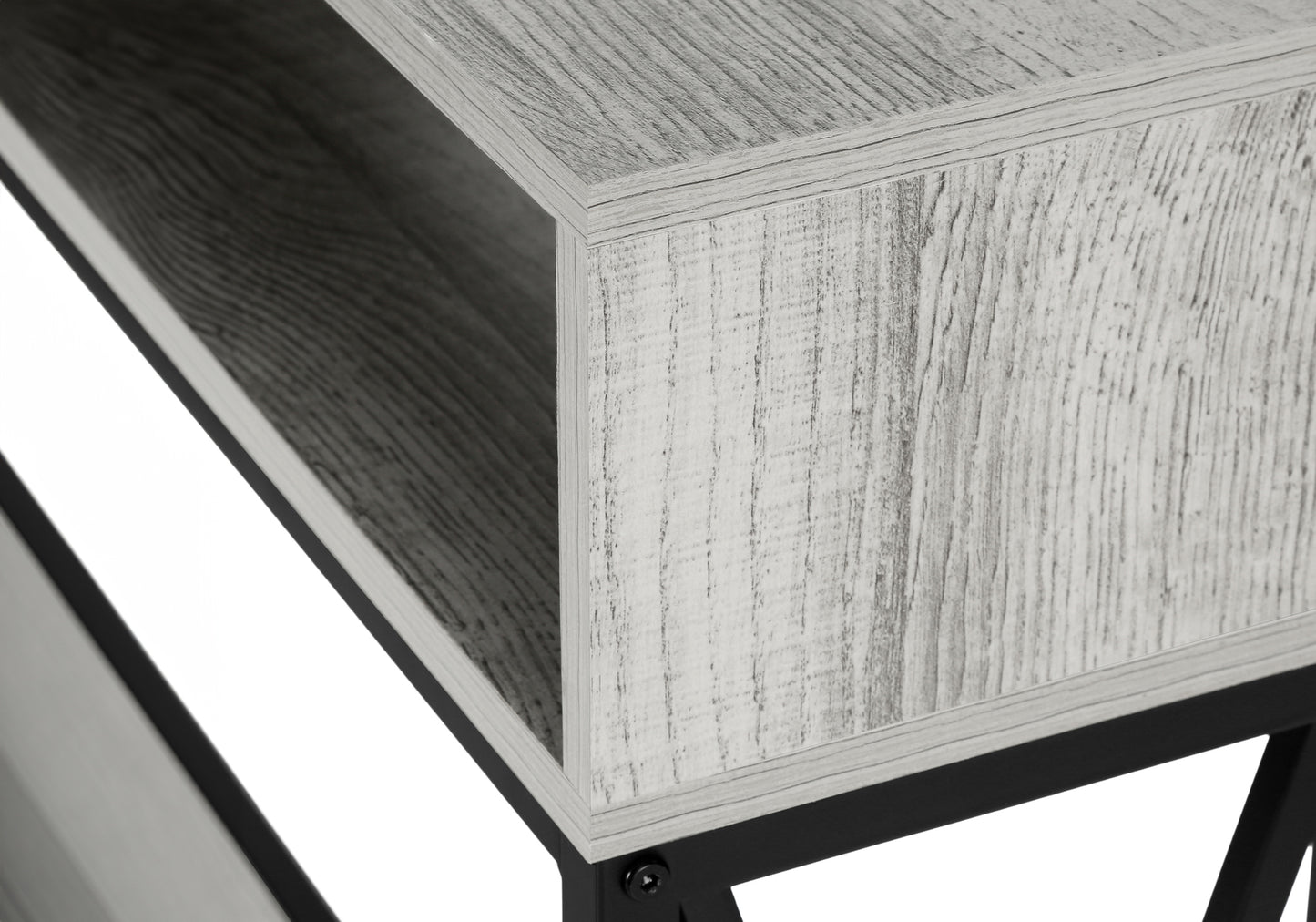 Closeup of a modern grey wood grain shelf unit with black metal legs