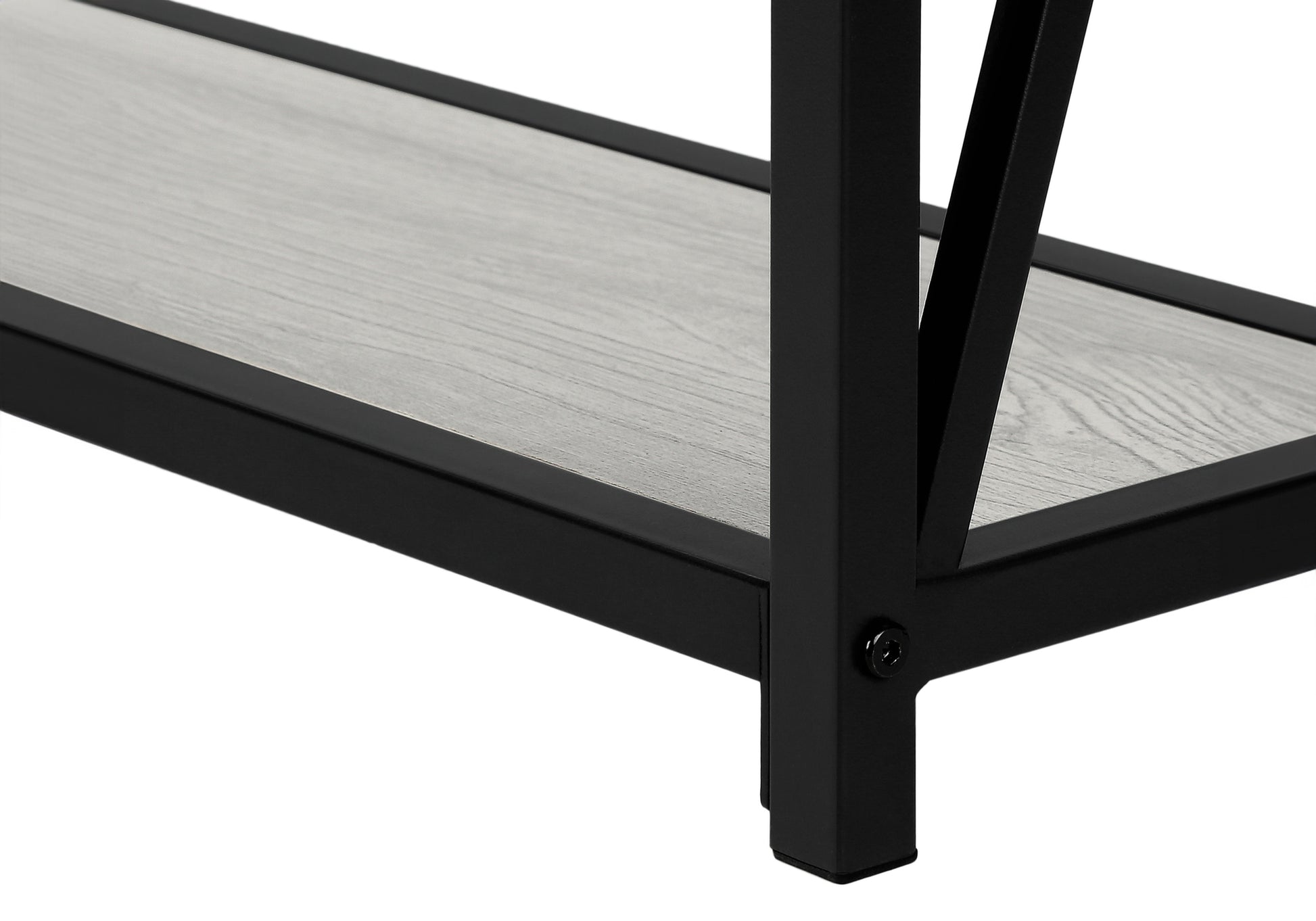 Closeup of a grey wood grain shelf with black metal frame detailing