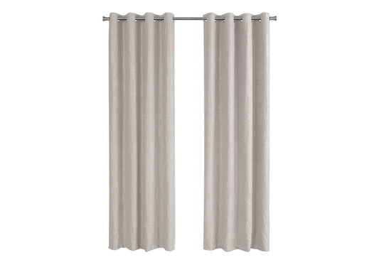 Pair of textured neutral linen blend grommet top curtains hanging on a rod