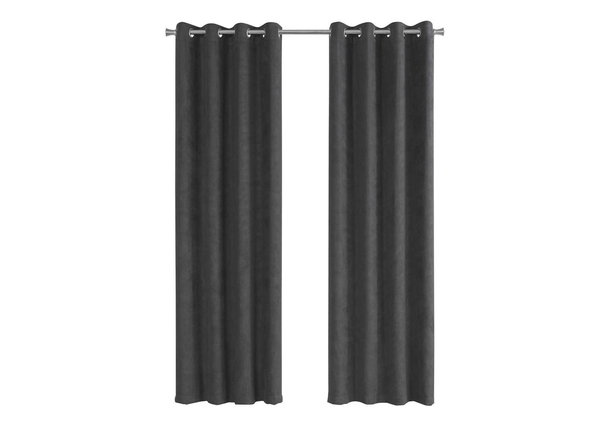Two dark grey velvet grommet top curtains hanging on a silver rod