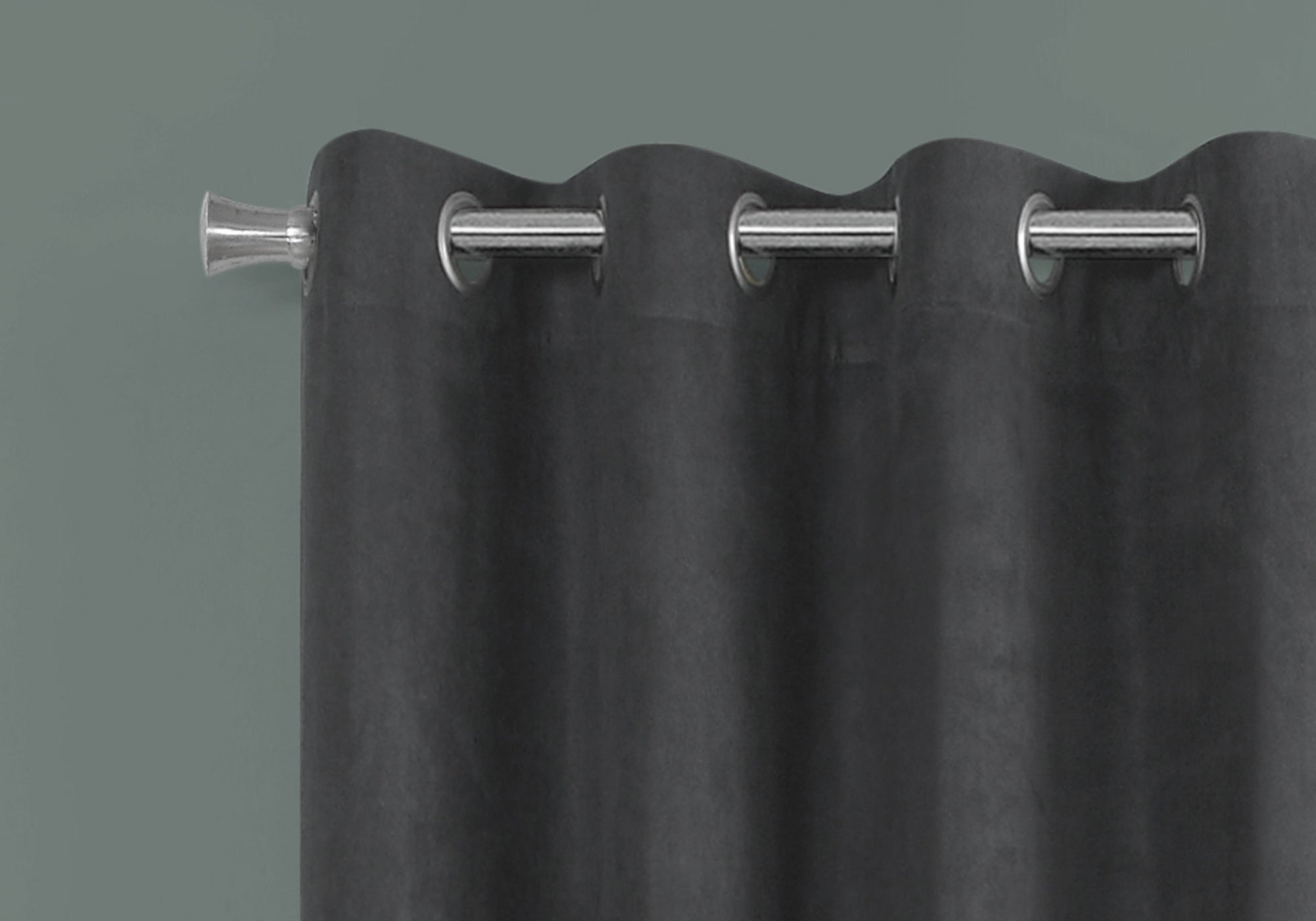 Charcoal grey velvet curtain with polished chrome grommets and finial