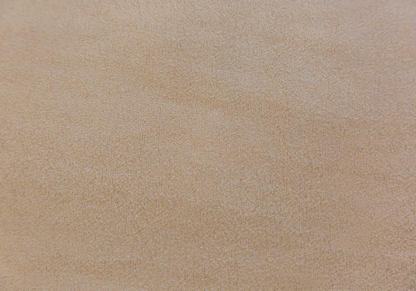 Closeup of a textured beige fabric ideal for upholstery or home decor applications