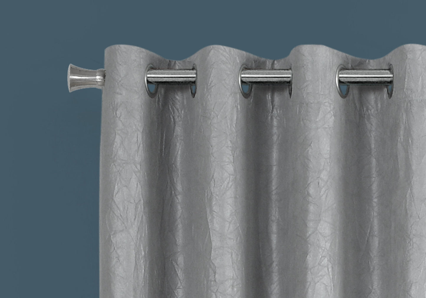Silver grommet curtain with embossed texture adds elegance to any room decor