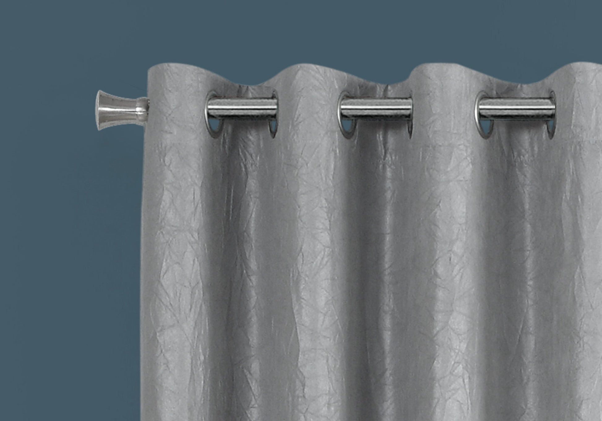 Silver grommet curtain with embossed texture adds elegance to any room decor