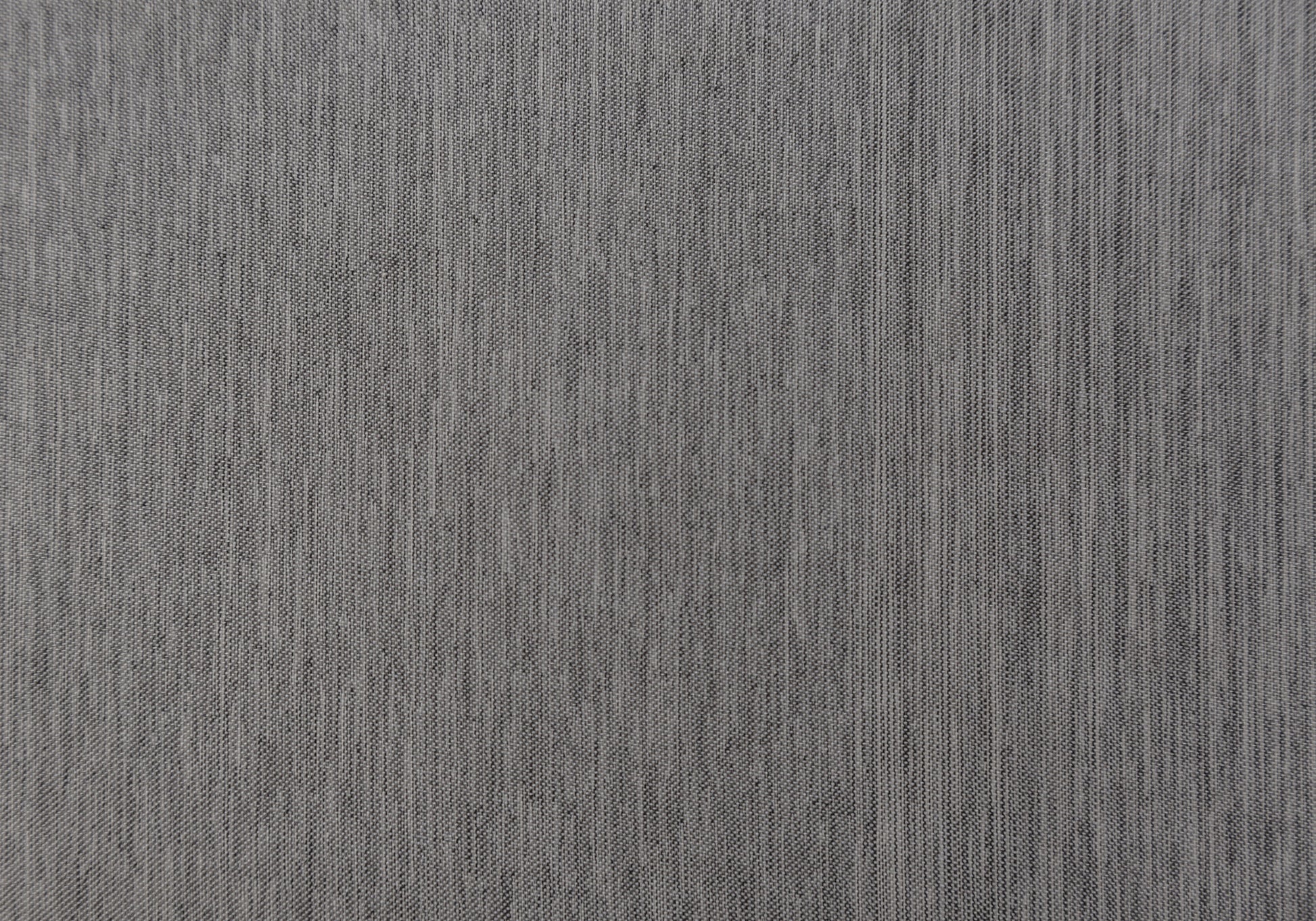 Closeup of textured dark grey woven fabric for upholstery