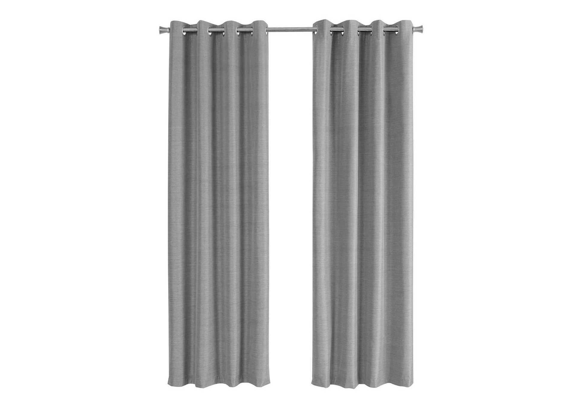 Two plain grey grommet curtains hanging on a metal rod