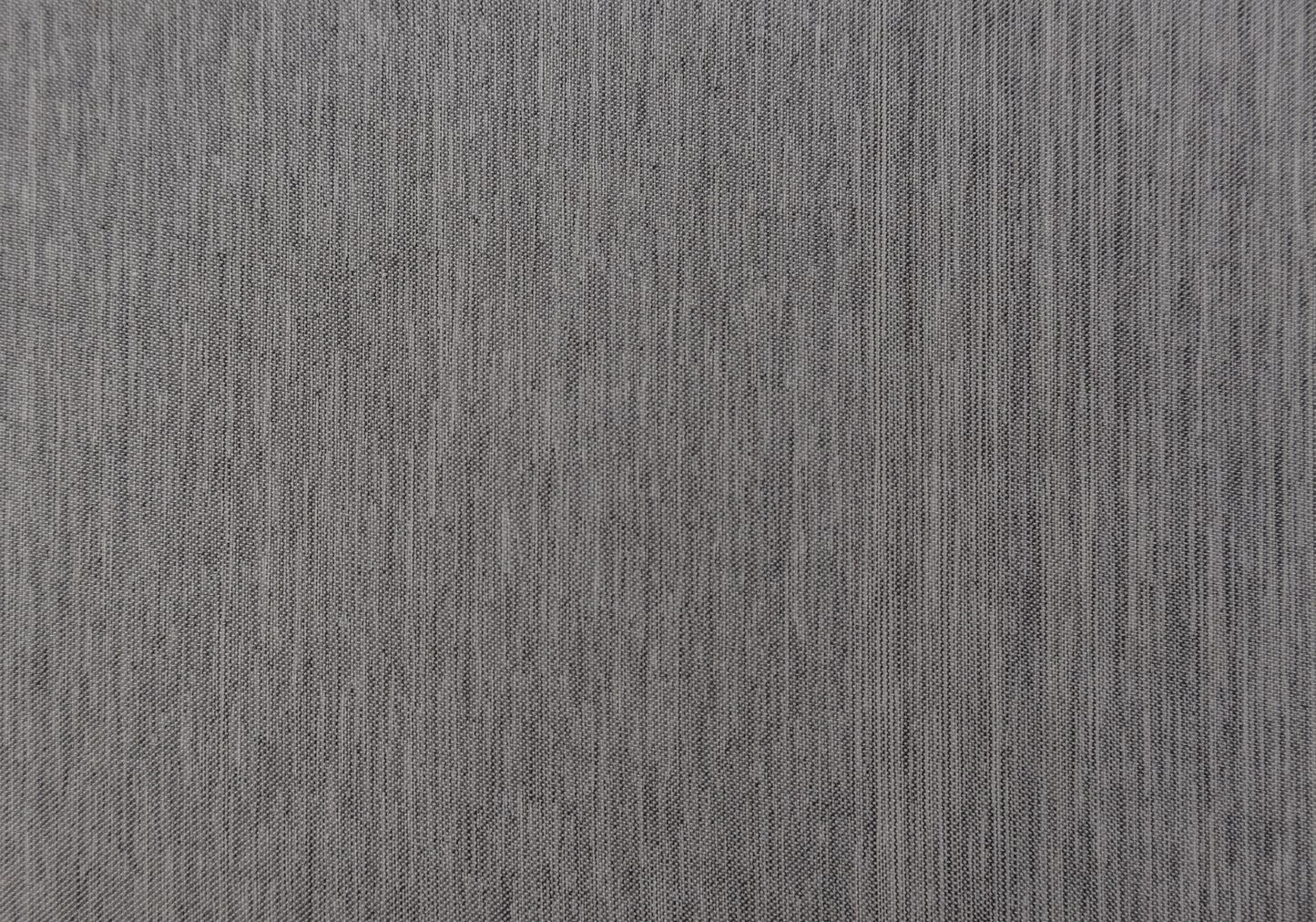 Closeup of a textured dark grey linen fabric with subtle vertical ribbing