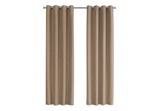 Two taupe grommet curtains hanging on a silver curtain rod creating a warm neutral window treatment