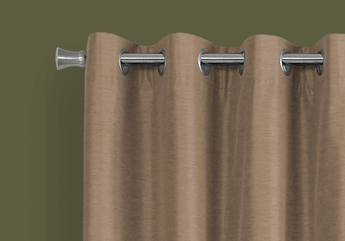 Brown grommet curtain with silver hardware against a dark green wall