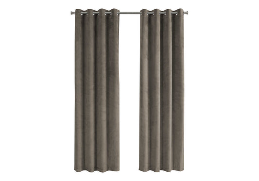 Two taupe velvet grommet curtains hanging on a metal rod for home decor