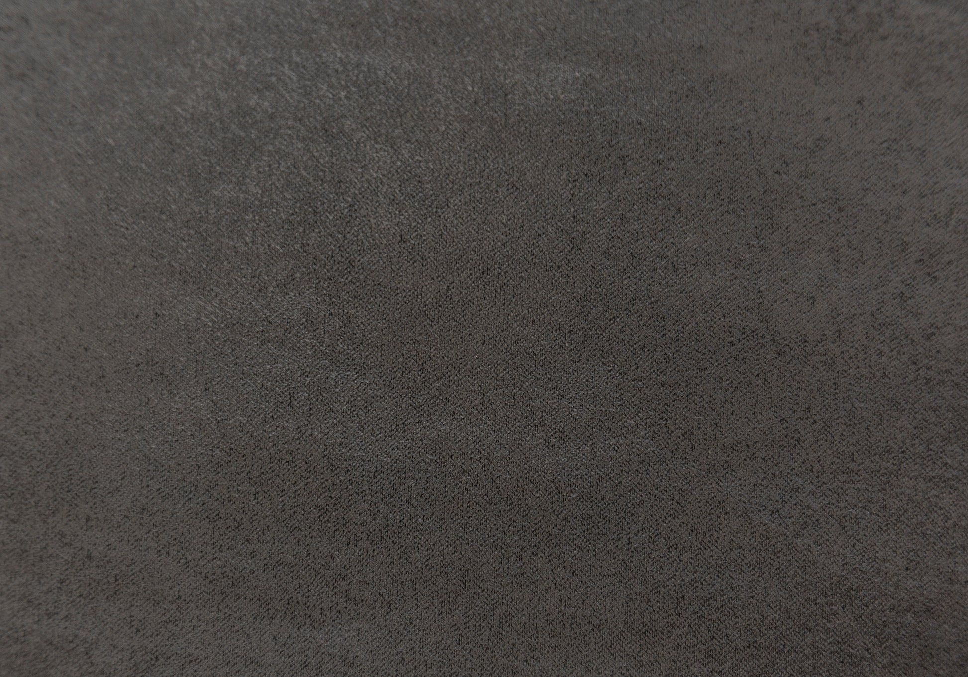 Closeup of dark grey textured fabric perfect for upholstery