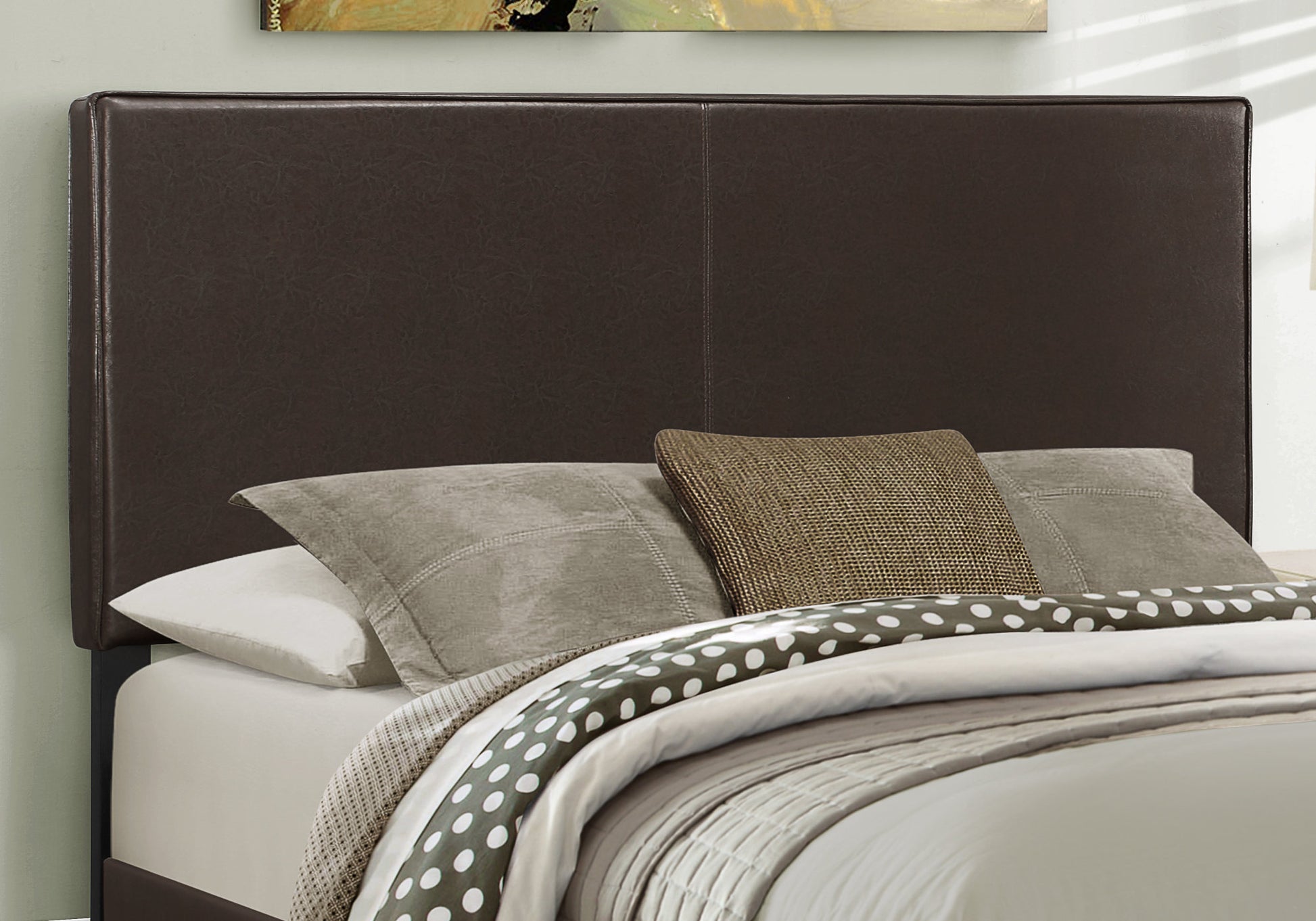 Dark brown faux leather headboard with clean lines and stitching detail