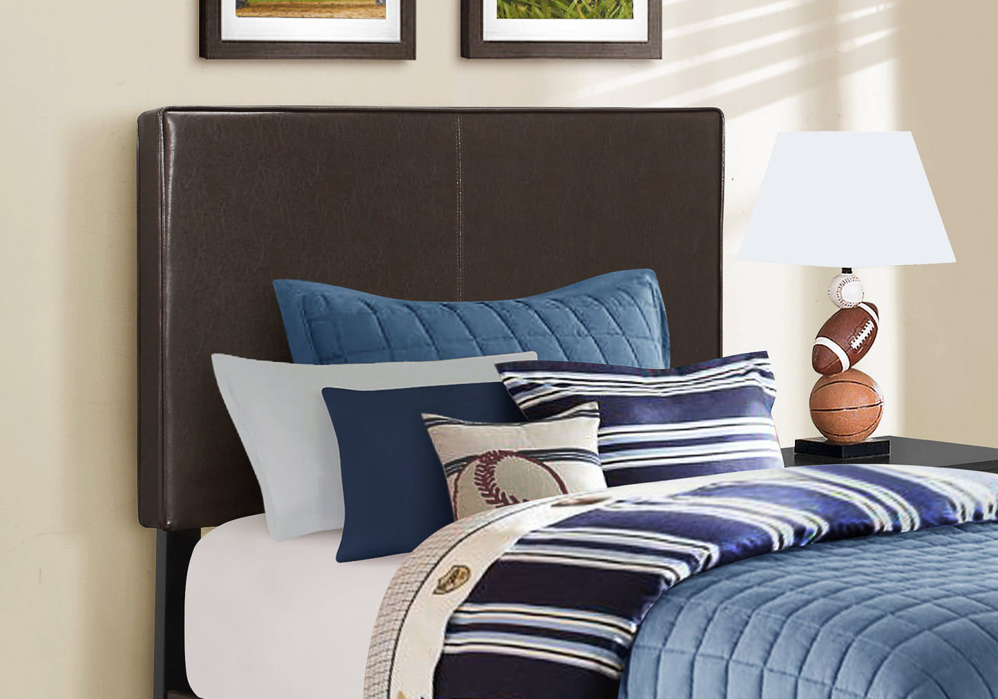 Dark brown faux leather headboard with stitched detail and baseballthemed bedding