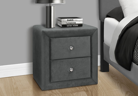 Plush dark grey velvet nightstand with two drawers and silver knobs