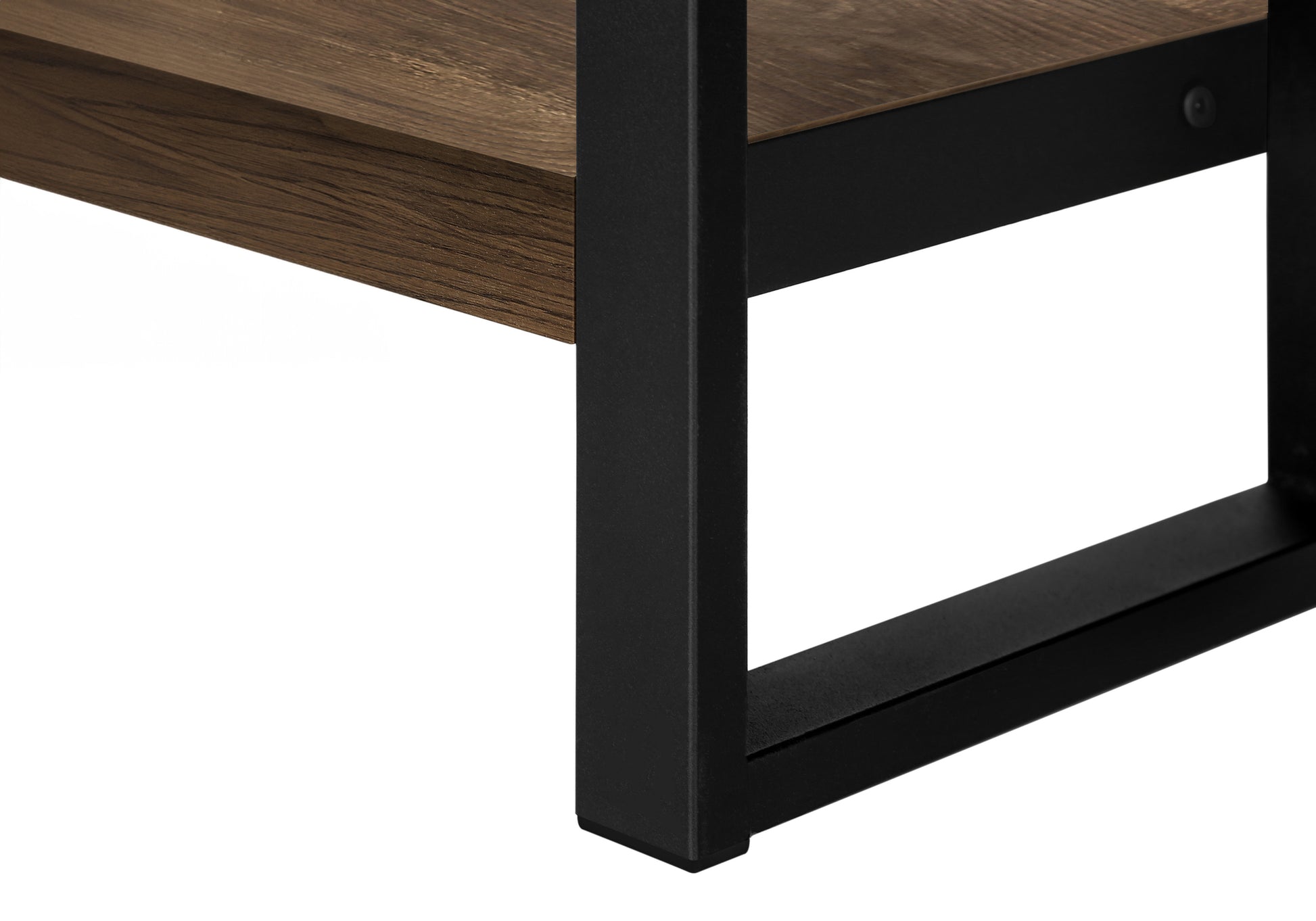 Close up of a rustic brown wood shelf supported by black metal legs