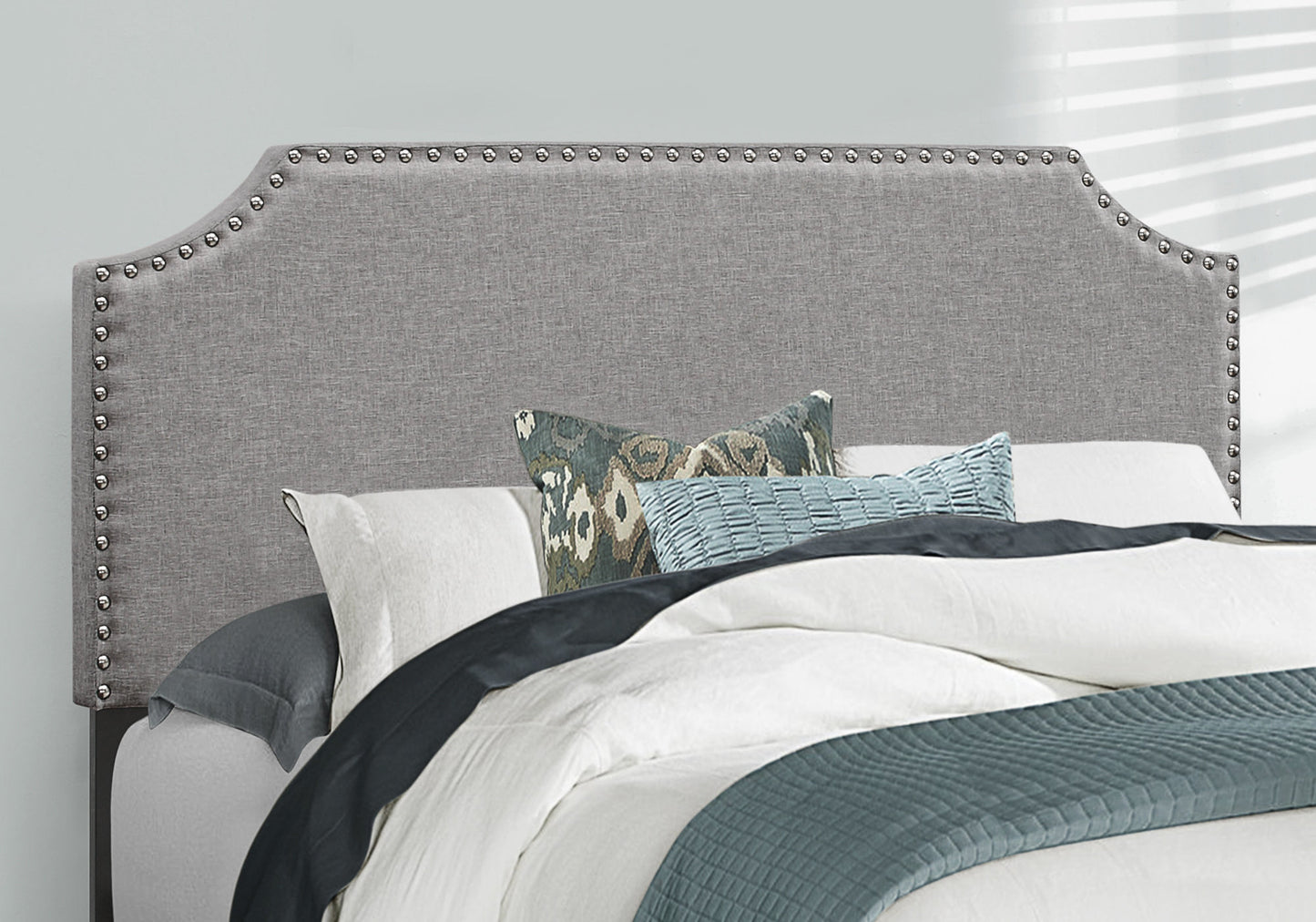 Gray upholstered headboard with nailhead trim classic bedroom furniture