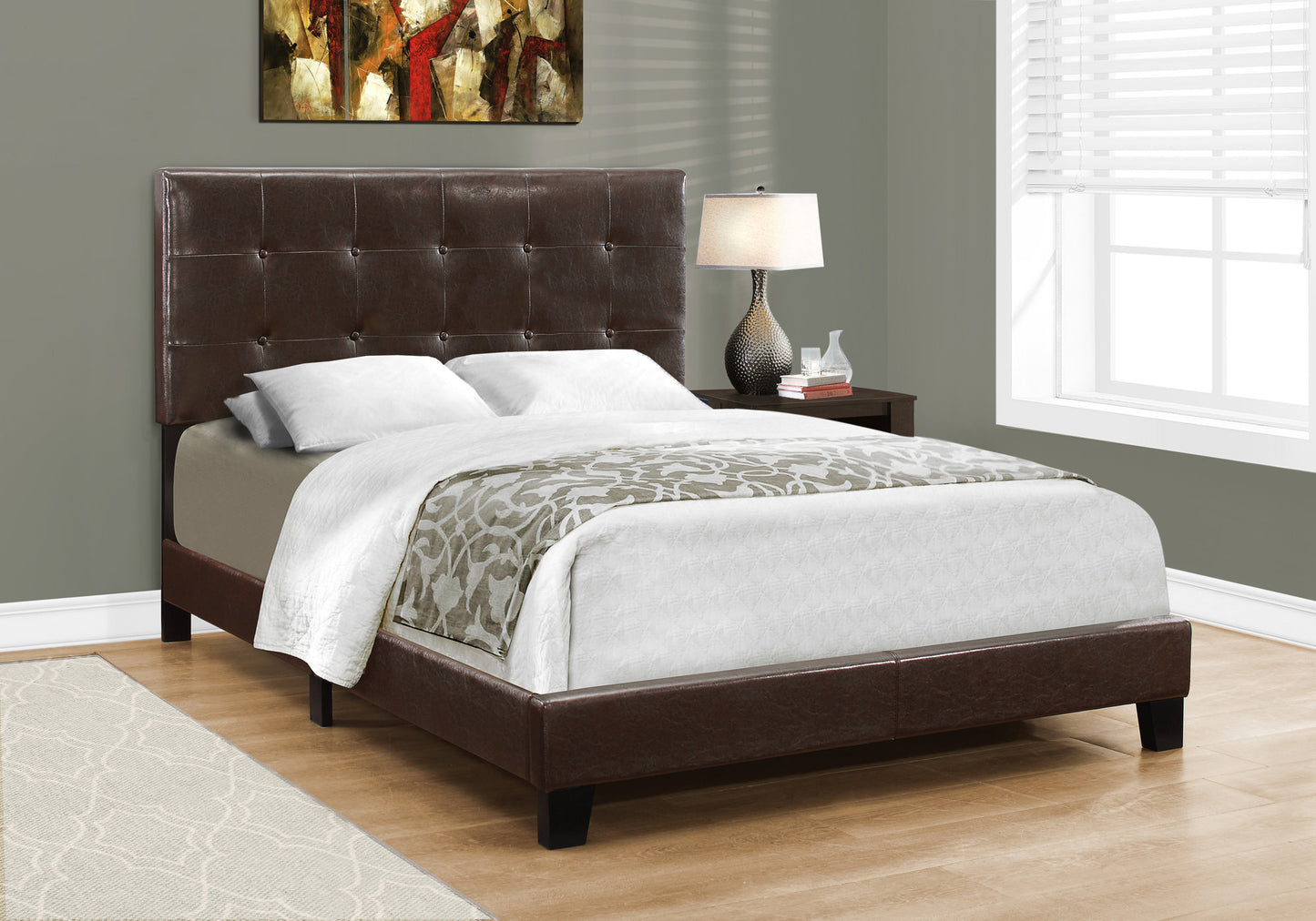 Tufted dark brown faux leather queen bed frame with dark wood legs and a patterned throw