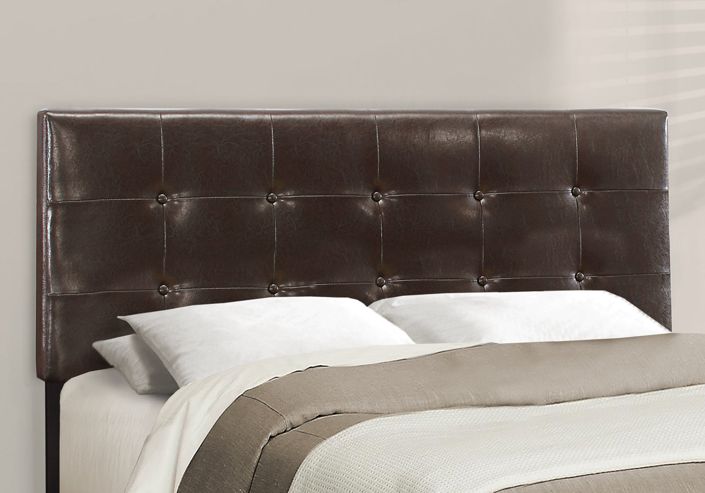 Dark brown faux leather tufted headboard with button accents