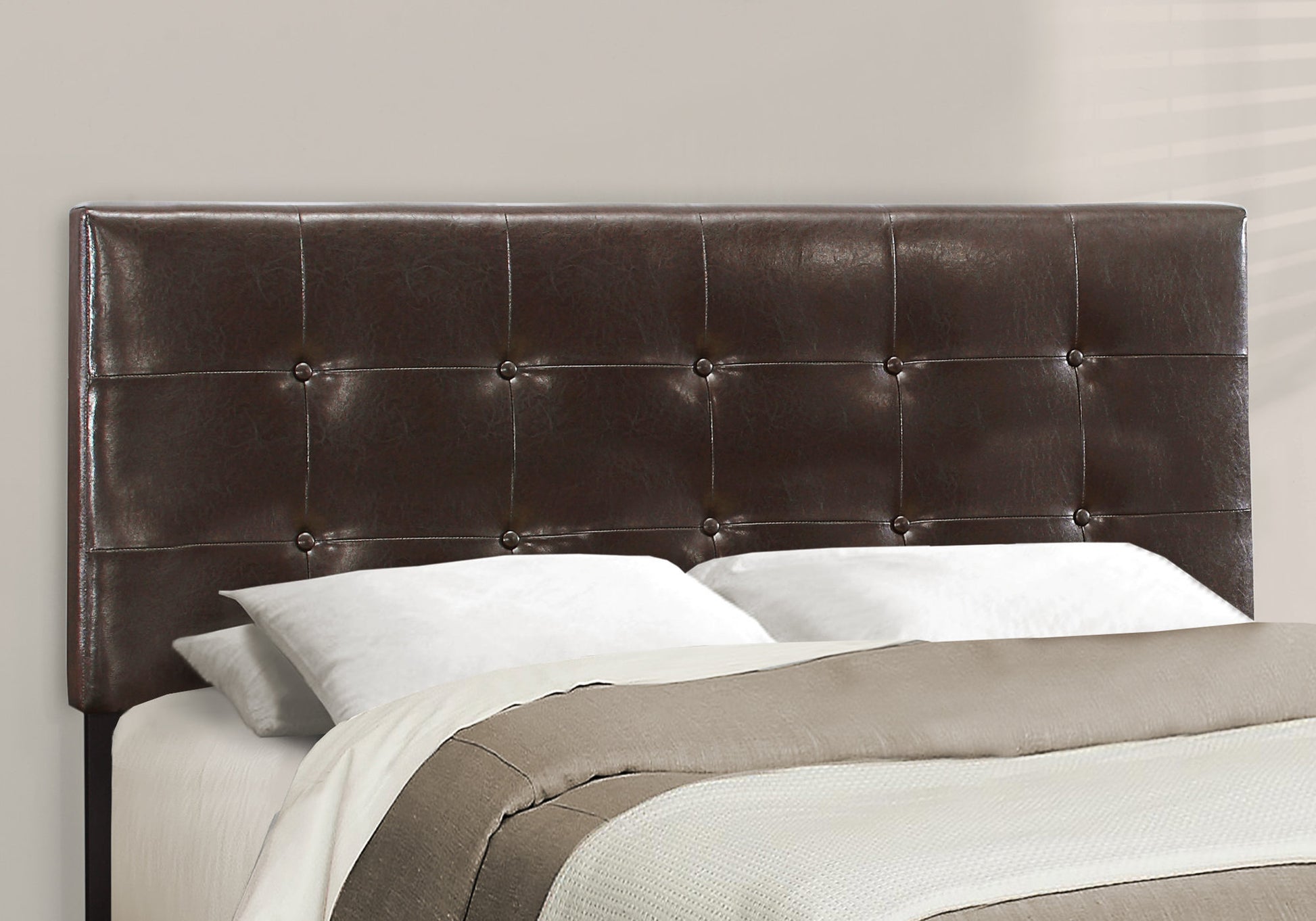 Dark brown faux leather tufted headboard with button accents