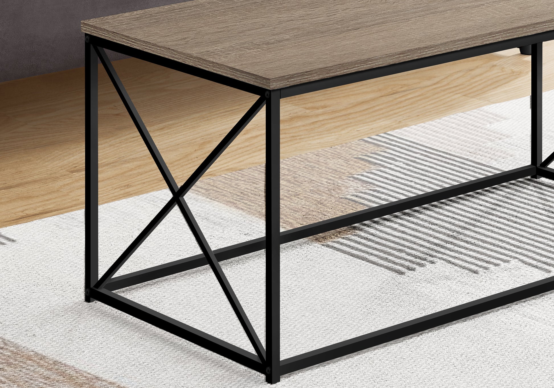 Modern oak wood coffee table with black metal frame and cross bracing detail