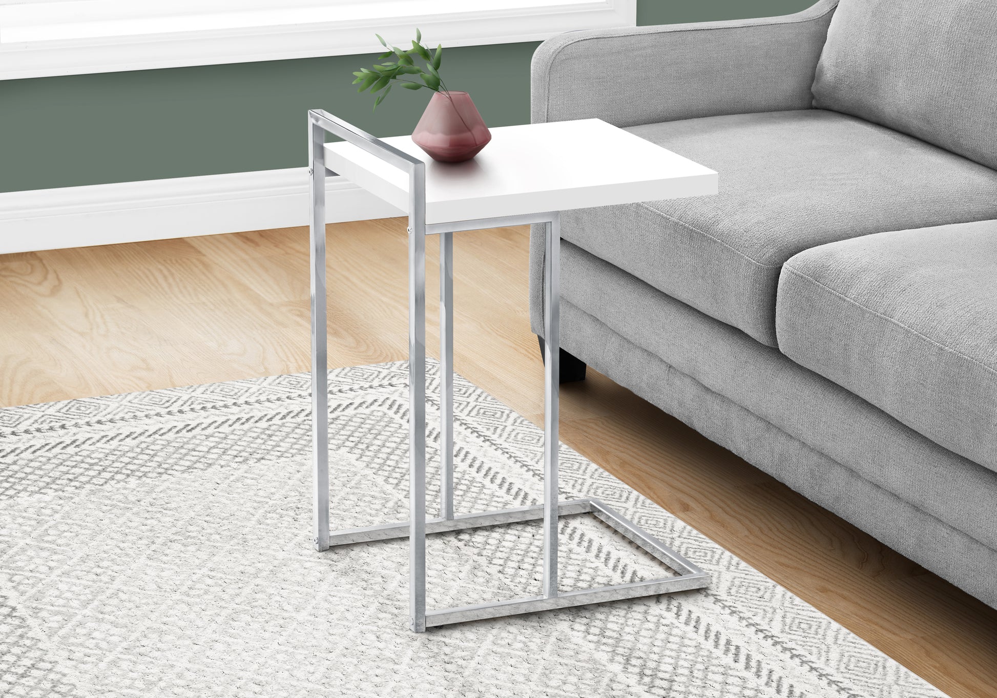 Modern C table with white top and chrome base perfect for living room