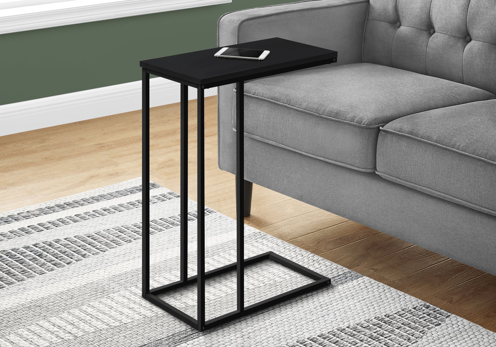 Sleek black ctable with modern metal frame ideal for living room couch side