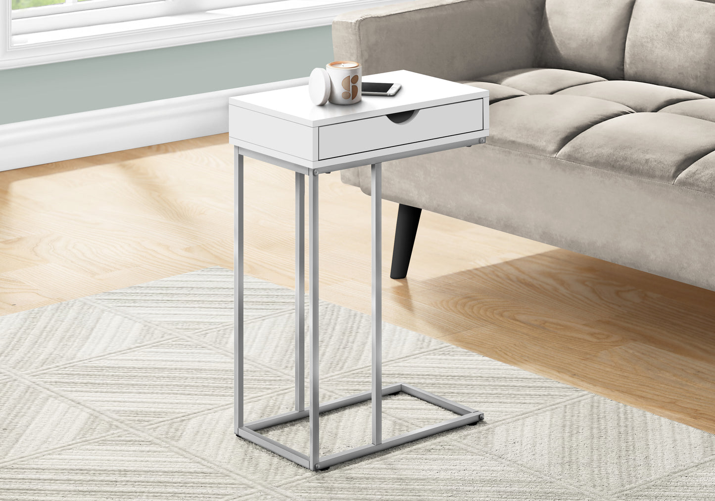 Sleek white c table with silver metal legs perfect for living room use