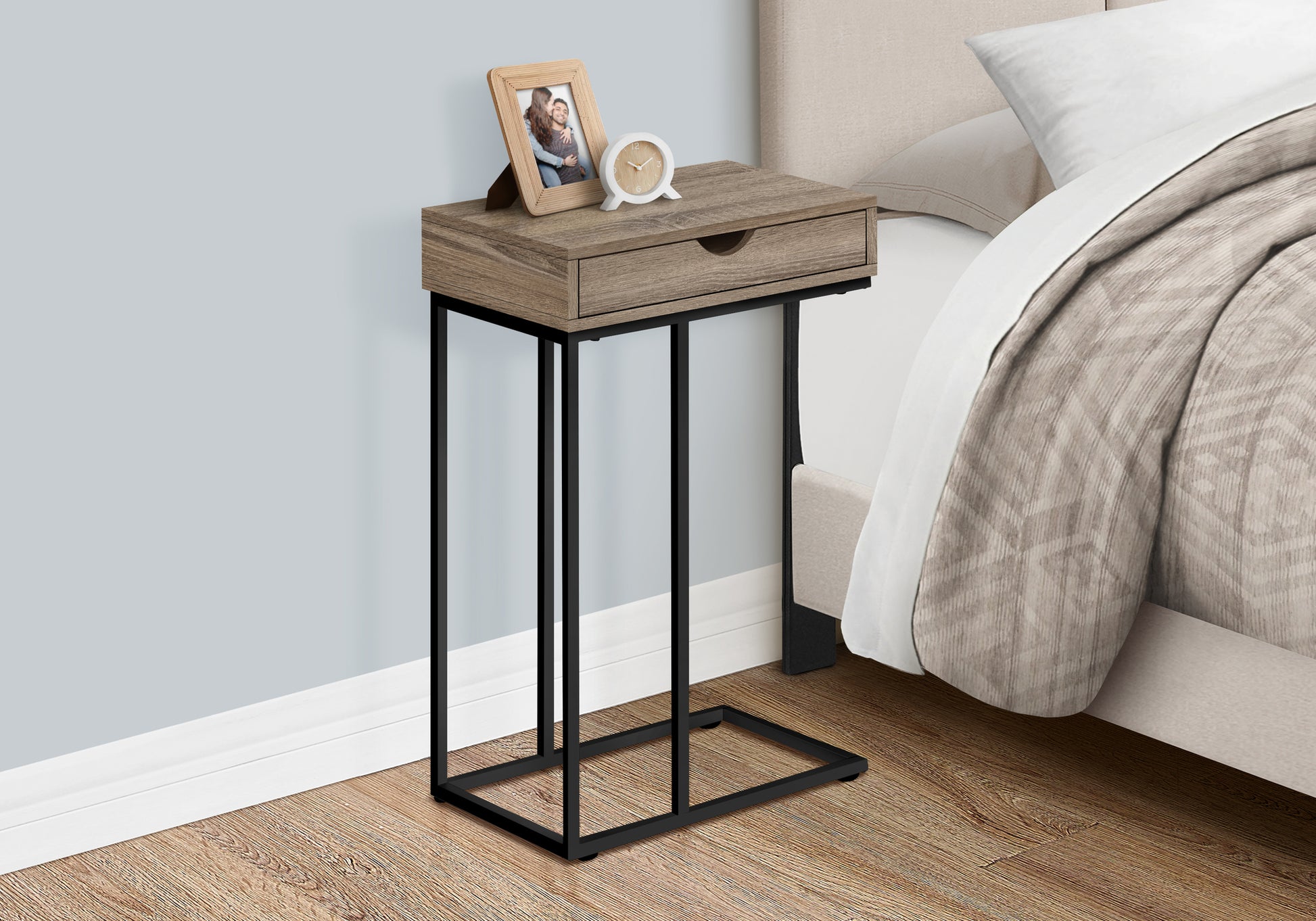 Rustic brown Ctable with black metal frame featuring a drawer and wood grain top