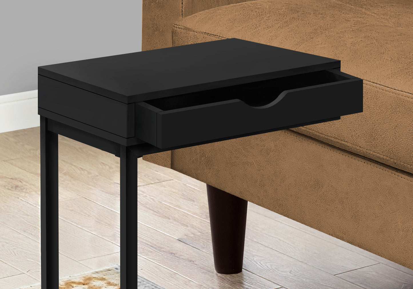 Sleek black end table with an open drawer ideal for modern living room decor