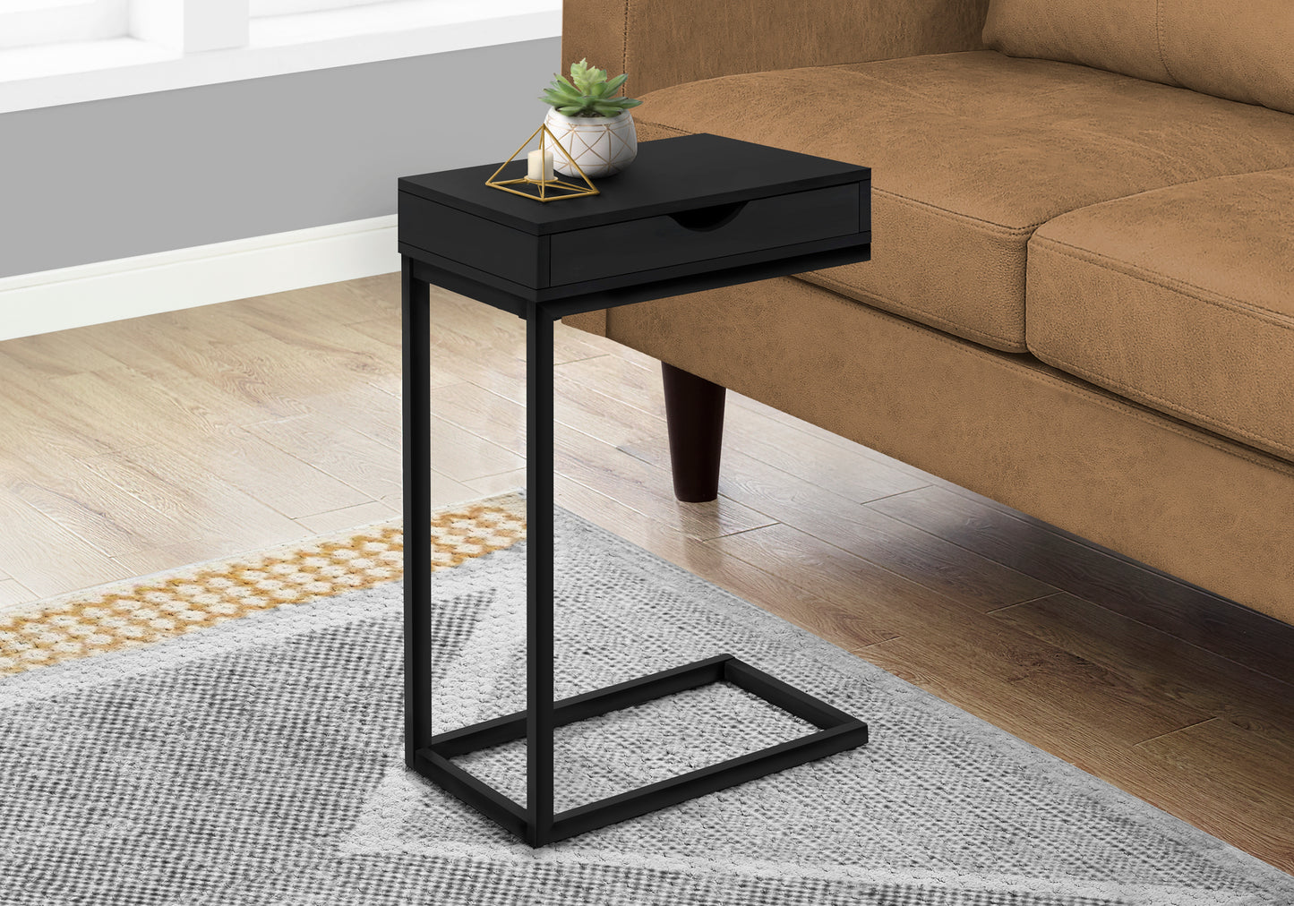 Sleek black Ctable with drawer perfect for beside a sofa